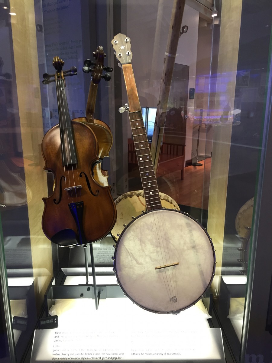 A fiddle and banjo displayed in the Roots of American Music Museum at the Blue Ridge Music Center