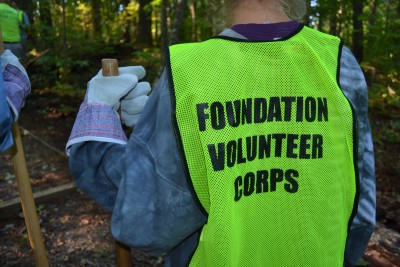 A volunteer in a corps safety vest