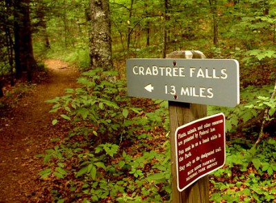 Trail sign in forest at Crabtree Falls on the Blue Ridge Parkway.