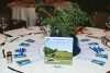 Dinner tables named after places on the Parkway with hemlock centerpieces