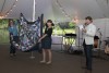 A denim quilt made by Georgia Bonesteel goes up for bidding during the live auction