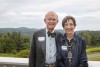 Bill and Judy Watson pose with a mountain background.