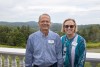 Jim Ulus and Barbara Gottschalk pose with a mountain background.