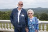 Joe Upchurch and Susan Kirkland pose with a mountain background.